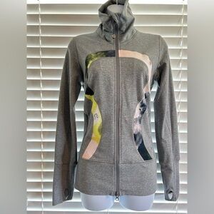 Rare Lululemon jacket, size 6, and in EUC.  Color: Grey w/ color logo